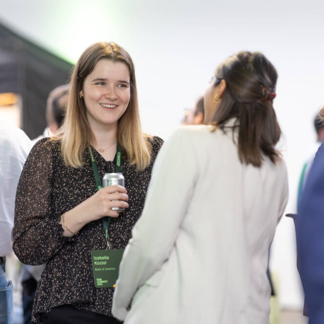 two people talking at event